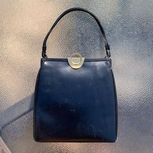 Vintage 1950s “Wilcof Originals" Blue/Black Leather Kelly Frame
Handbag